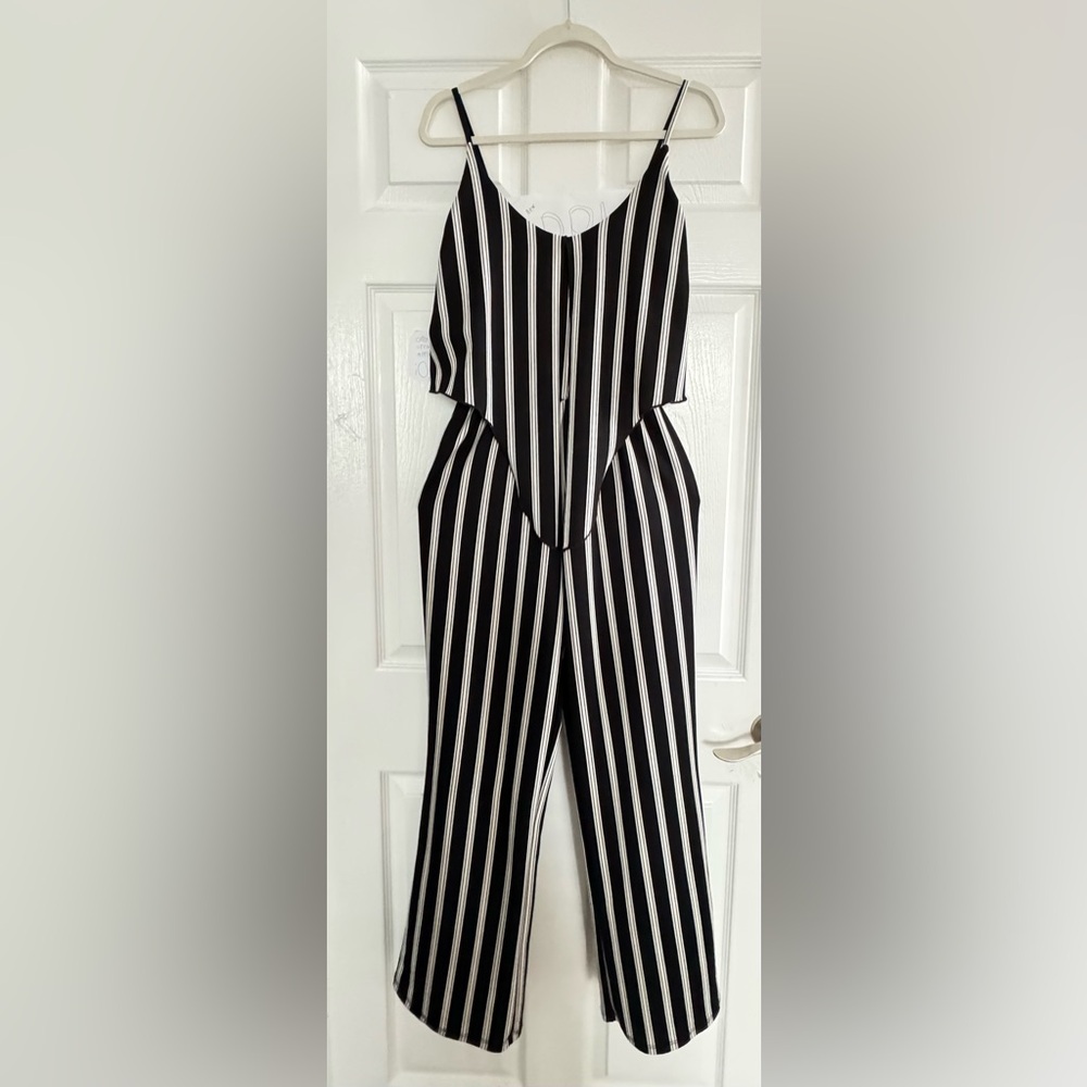 jumpsuit small white and black stripes sleeveless design w thin straps on top.